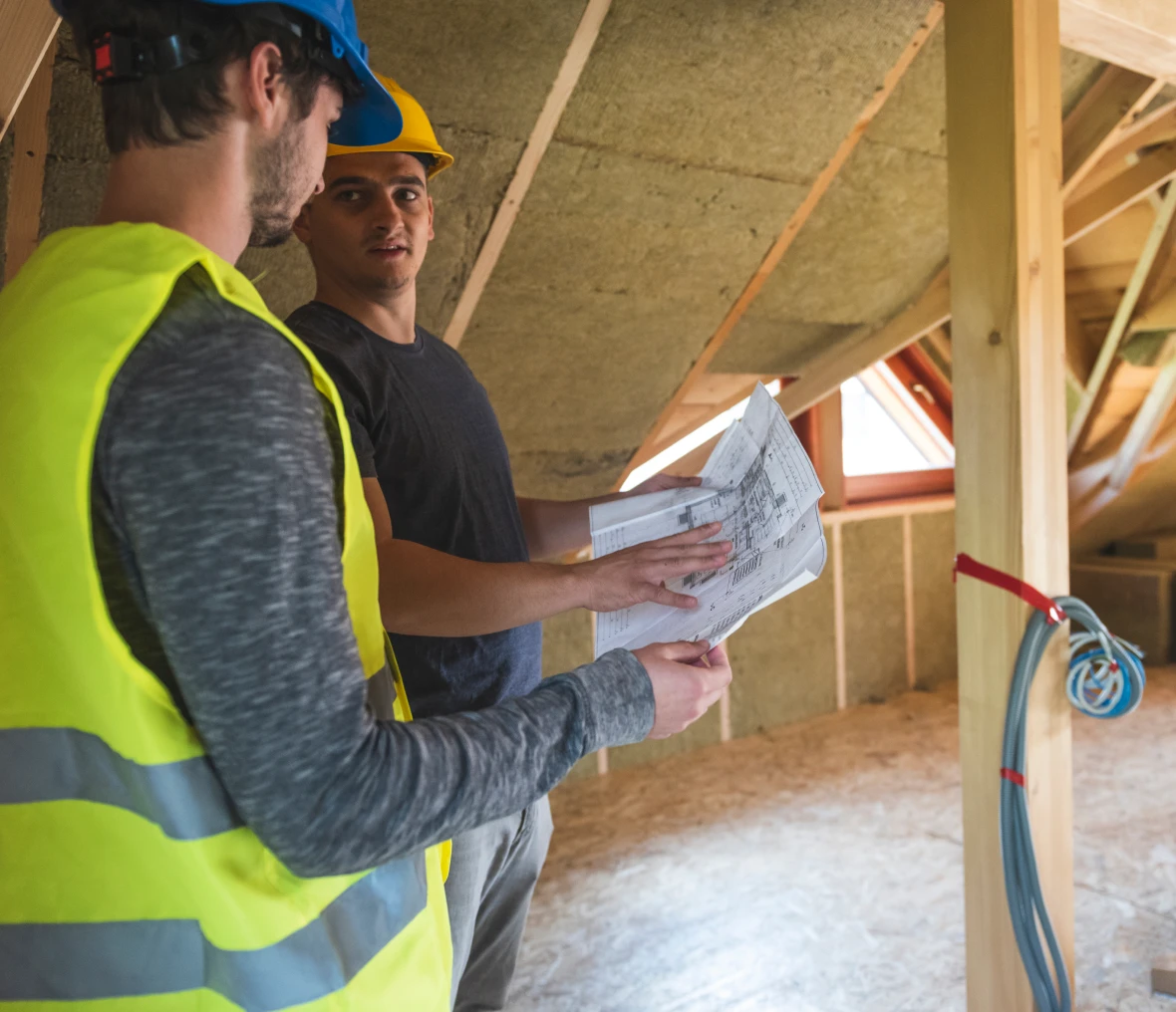 Construction workers discussing building plans